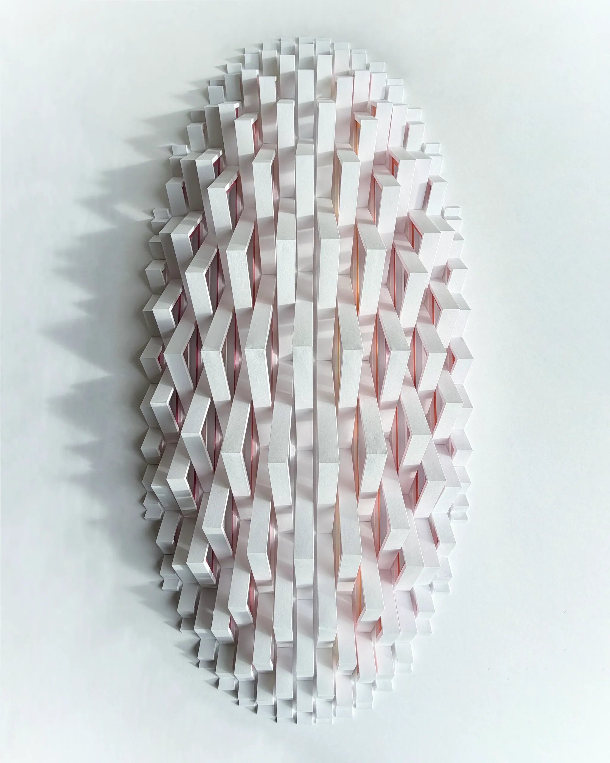 No. 24 – Triangula – The work from the front in raking light from the right, the modules casting jagged shadows to the left