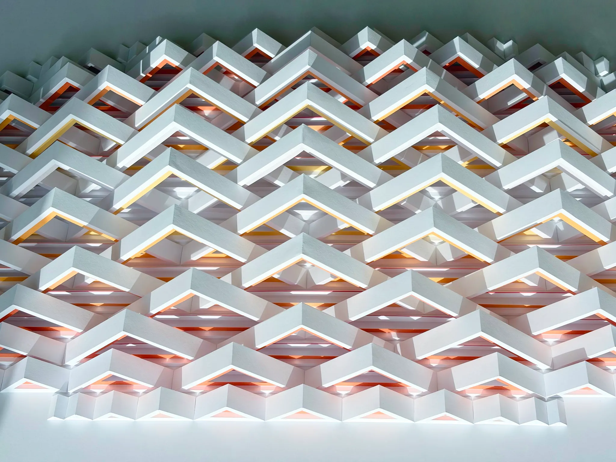 No. 24 – Triangula – Seen from below, rows of white chevrons with yellow-orange undersides down to the flat edge
