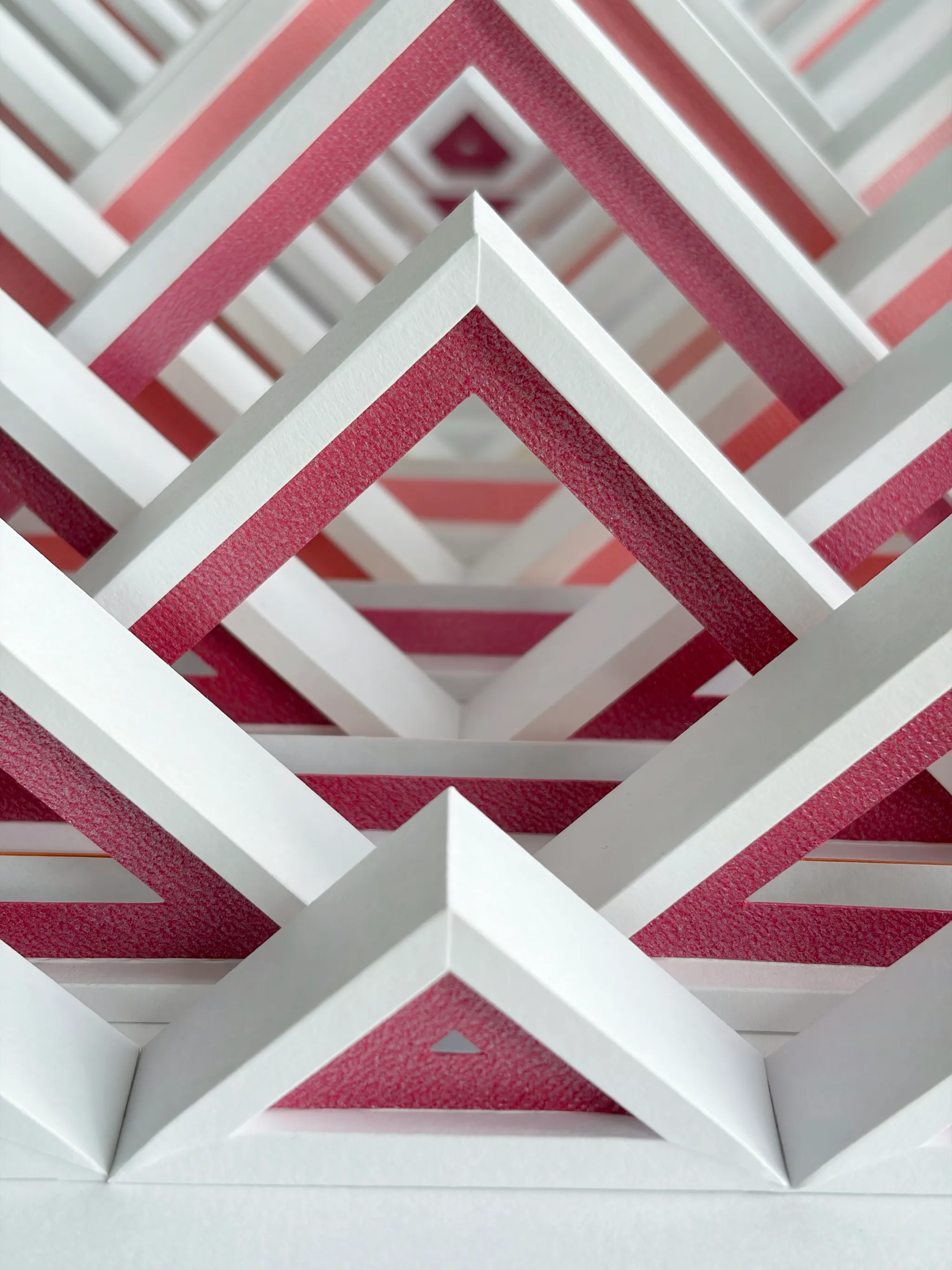 No. 24 – Triangula – A view into the depth of the relief, behind every triangle another one opening with a dark pink contour