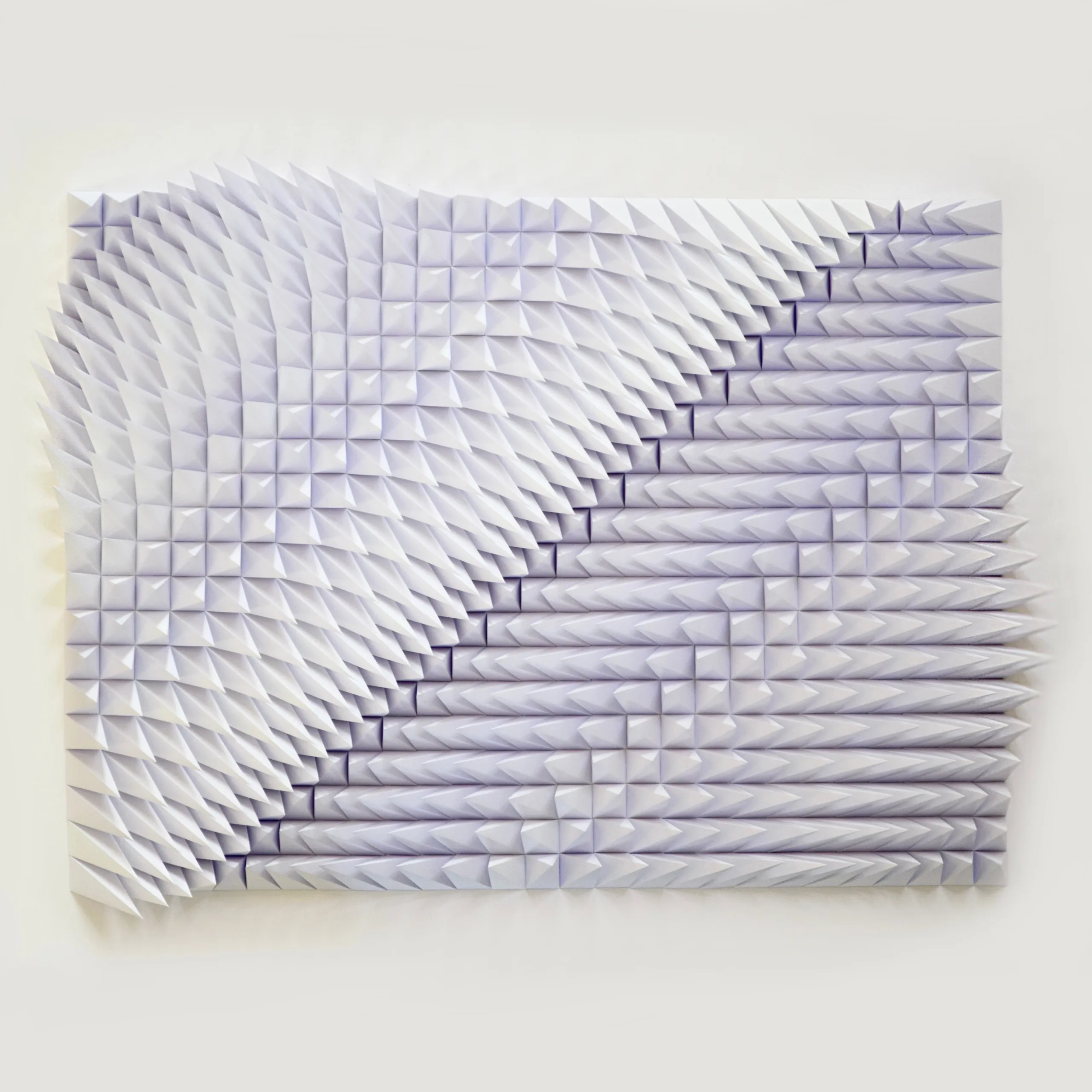 The white pyramid relief from above at an angle, the tips running diagonally across the whole surface