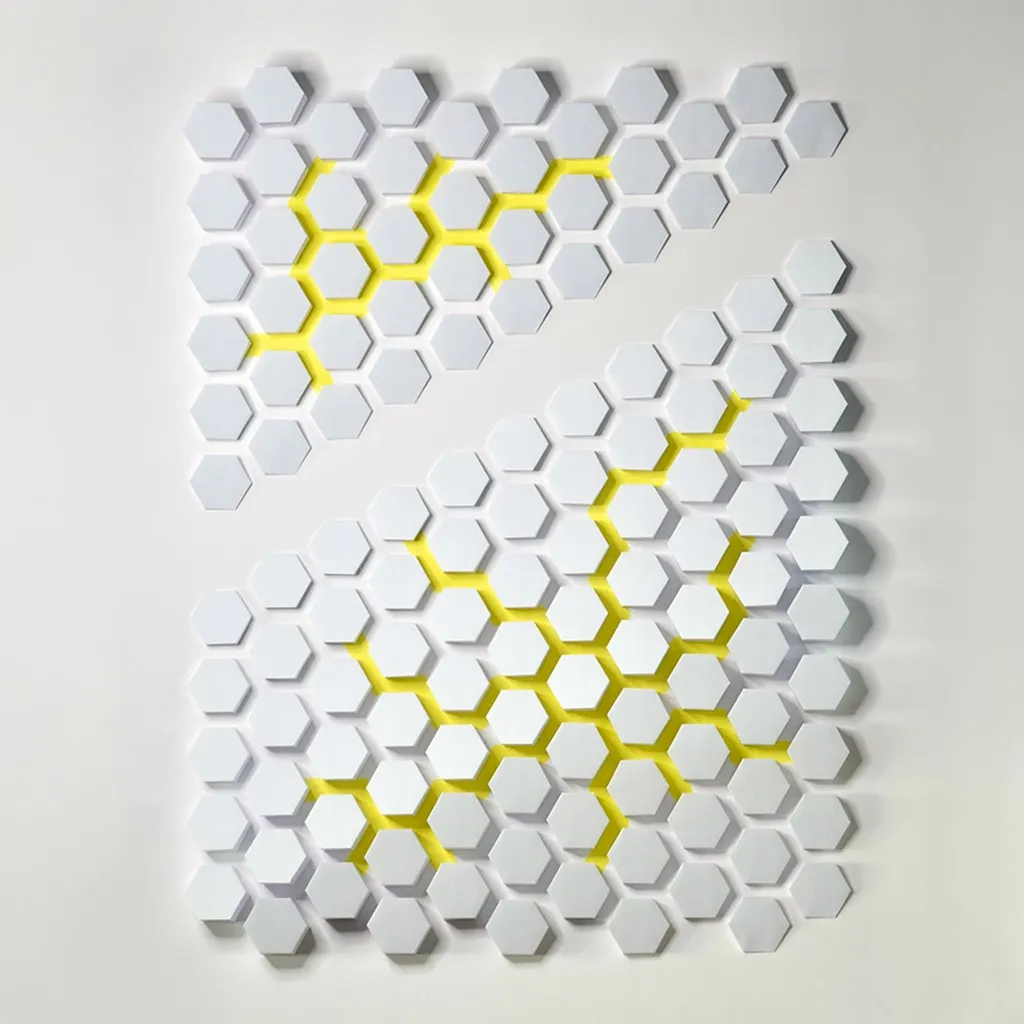 The whole work head-on, white hexagons in two offset fields, yellow gaps running diagonally through them